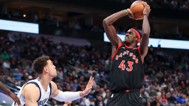 Toronto Raptors forward Pascal Siakam shoots over Dallas Mavericks center Dwight Powell.